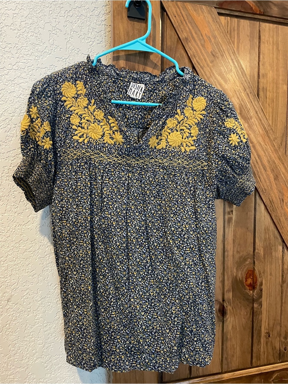 Nested Floral Embroidered Navy Blouse with Yellow Accents by SISTER MARY
